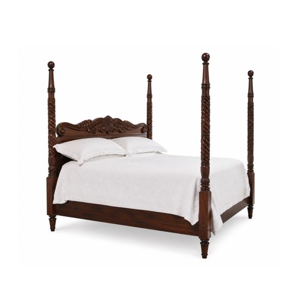 Colonial carved teak bed with tall spindle posts and ornate wooden headboard