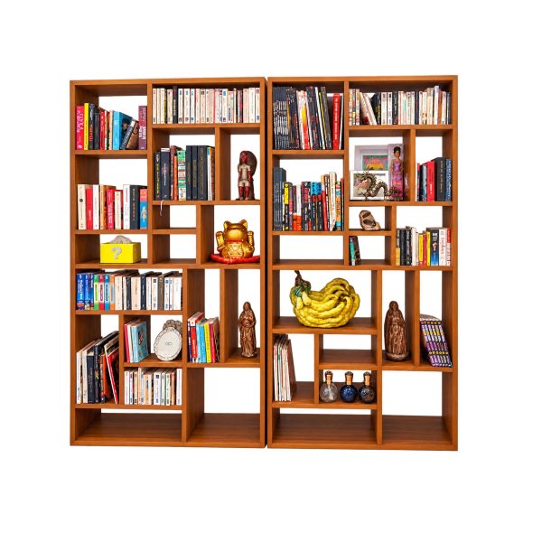 Teak bookshelf styled with decorative accessories in a modern interior