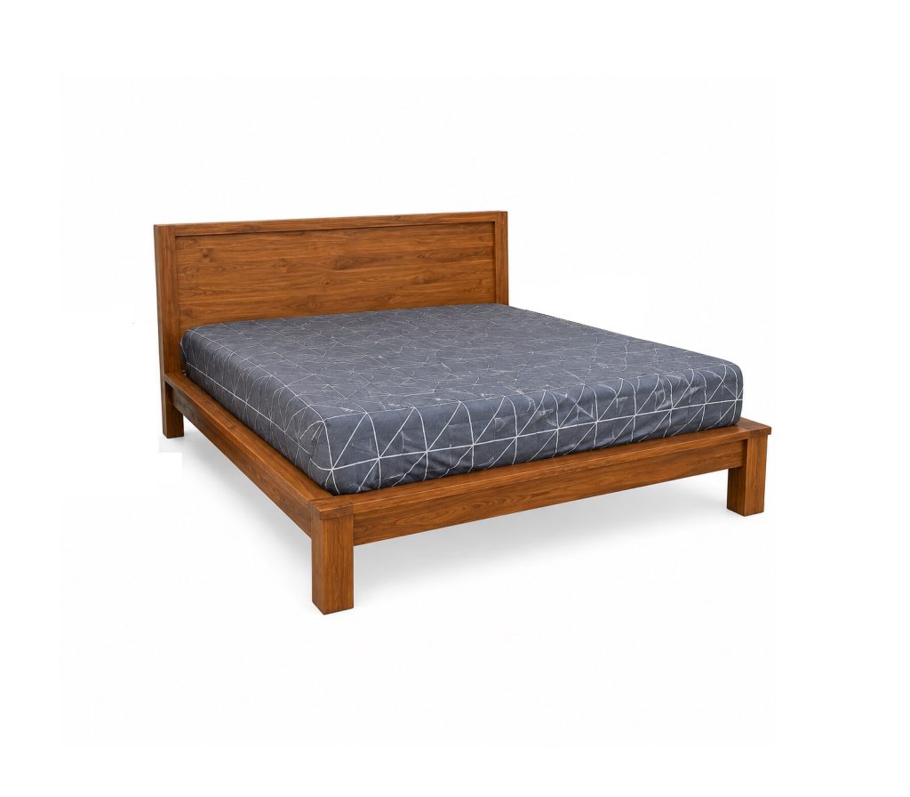Heritage teak panel bed with natural wood finish and wide wooden headboard
