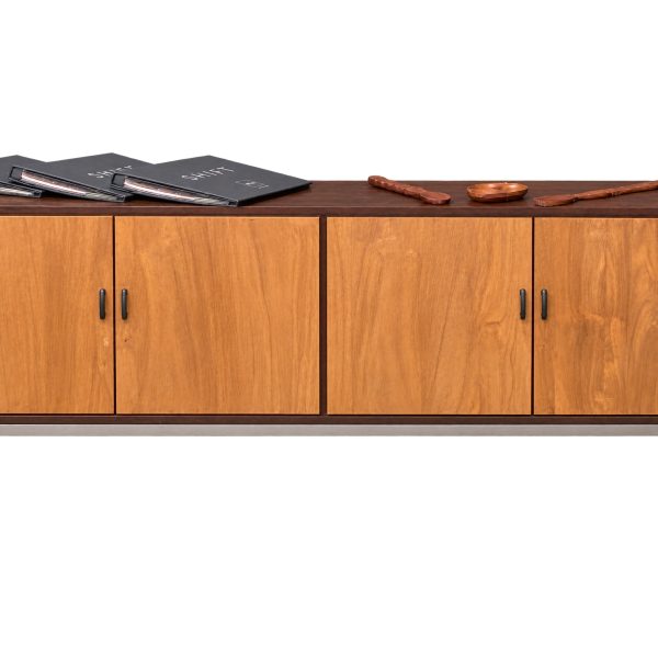 "Sierra Teak Sideboard showing warm teak door panels, contrasting dark frame, and modern handles"