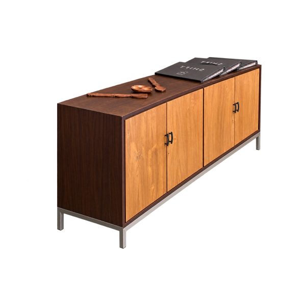 Angled view of Sierra Teak Sideboard showing natural teak grain, four doors, and metal base