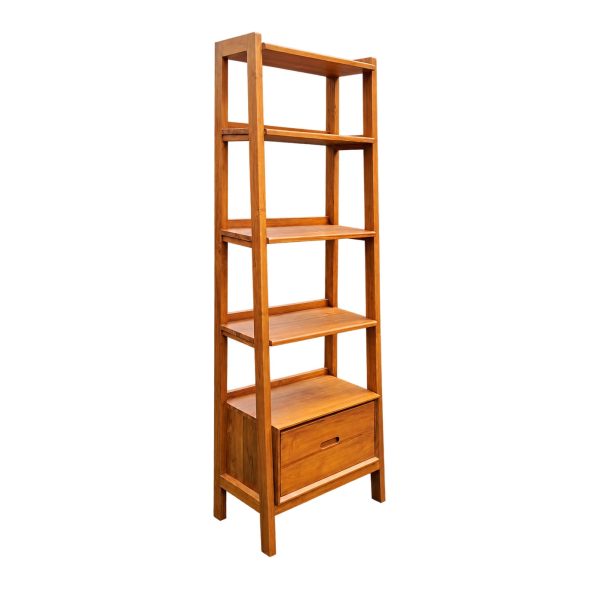 Narrow Orvella teak bookshelf viewed at an angle, showing its wooden side frame, shelves, and drawer.