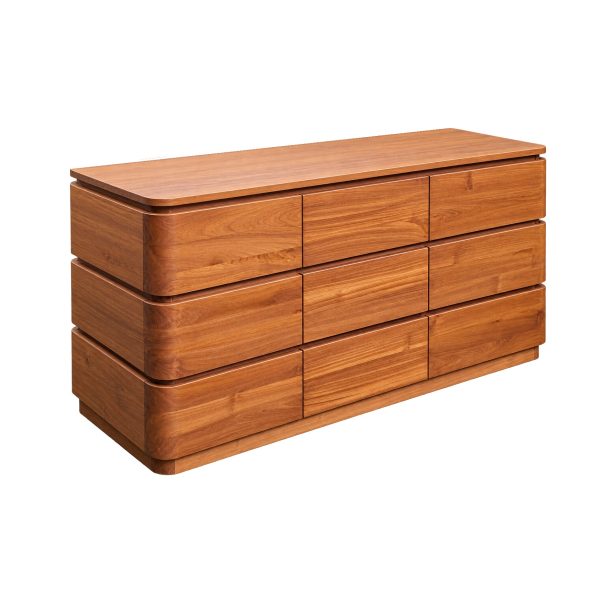 Sora teakwood chest of drawers featuring rounded edges, natural wood grain, and nine drawer fronts.